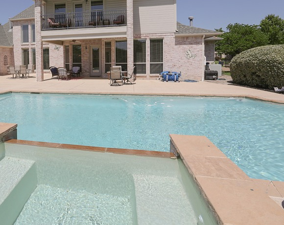 pool demolition in the backyard of a house